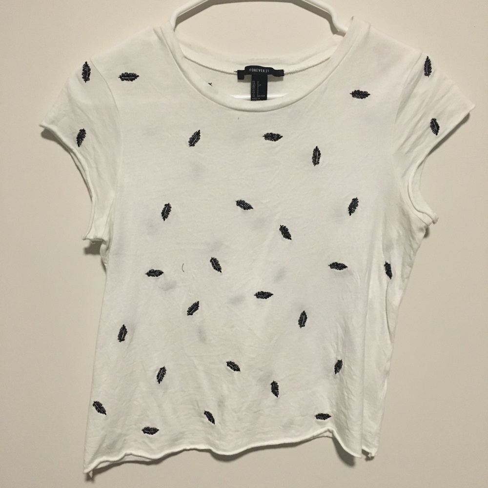 White T-shirt with black embroidered feathers